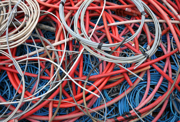 istock abandoned high-voltage electric cables and other power cords in 829363304