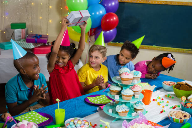 istock Cheerful children at birthday party 829363656