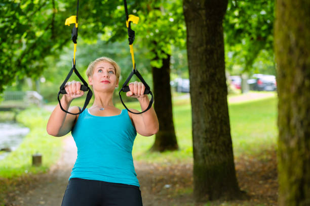 istock woman doing suspension sling trainer sport 829365944
