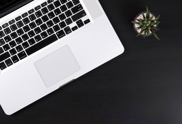 istock Business's desk Office with notebook and cactus.Top View table from above with copy space 829374196