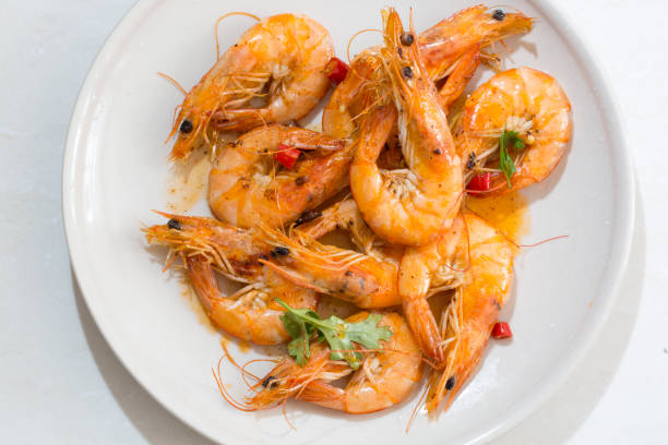 istock Seafood prawns closeup on a white dish. 829377450