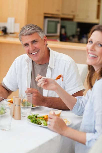 istock Happy couple eating their dinner 829379146