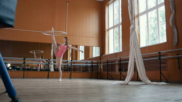 istock Graceful girl ballerina practicing in the Studio, elements of acrobatic 829379458