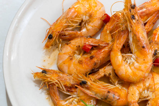 istock Seafood prawns closeup on a white dish. 829379944