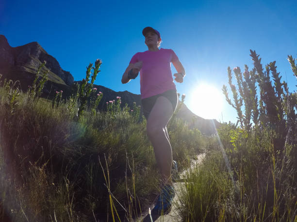 istock Female running along a footpath 829381360