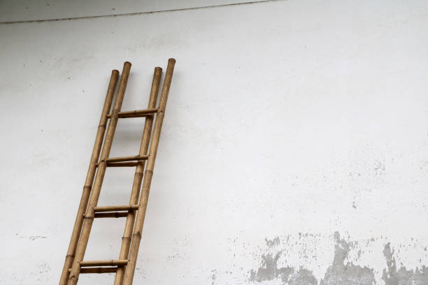 istock Bamboo stairs leaning against the wall. 829388088