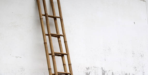 istock Bamboo stairs leaning against the wall. 829388094