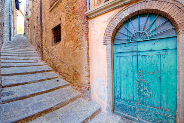 Old door and stairs of the medieval town of Cortona, Tuscany Old door and stairs of the medieval town of Cortona, Tuscany cortona stock pictures, royalty-free photos & images