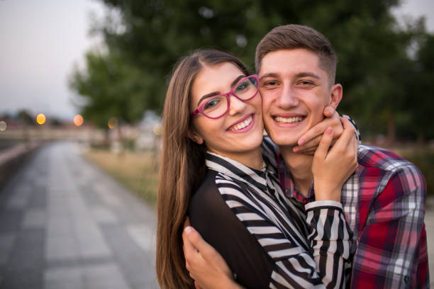 istock Young cute couple hugging in love 829397338