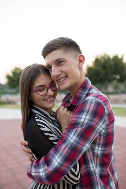 istock Young cute couple hugging in love 829400044