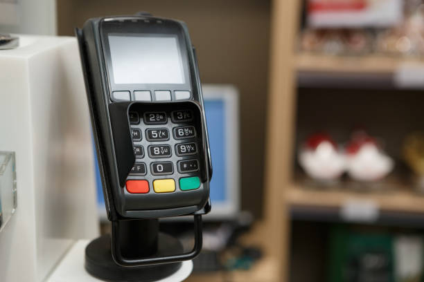 istock Credit card terminal at checkout in store 829407530