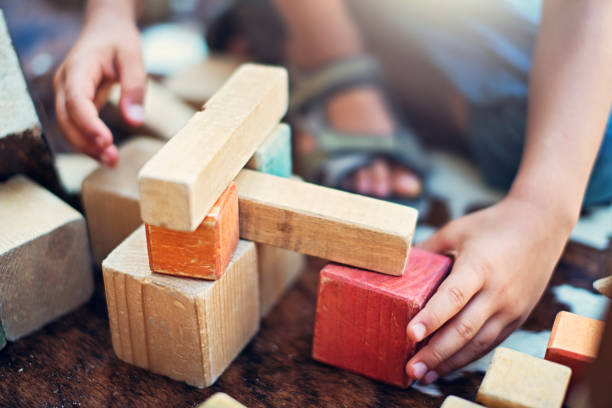Child playing with wooden blocks