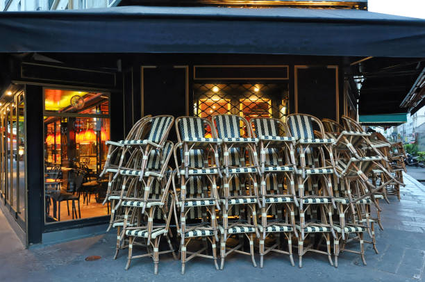 istock Parisian cafe chairs in early morning 829415380