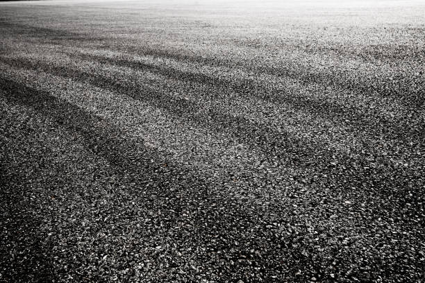 istock close-up horizontal view of new asphalt road 829421040