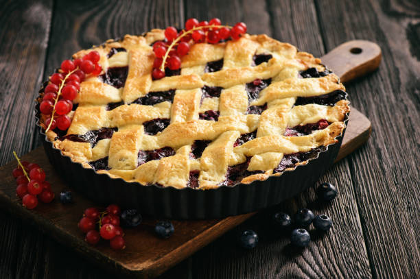 istock Homemade blueberry pie on wooden background. 829421488