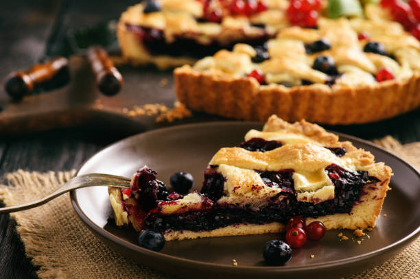 istock Homemade blueberry pie on wooden background. 829421520