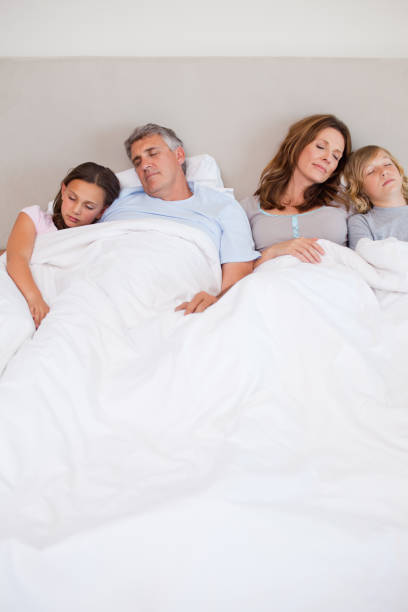 istock Family sleeping in the bedroom 829422678