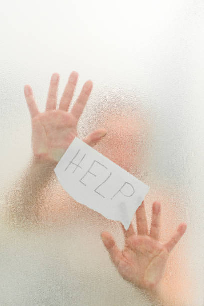 istock Abused woman seeks help from violence holding a paper 829436626