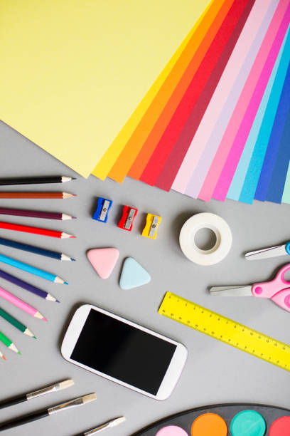 istock Colorful school supplies on grey background 829436684