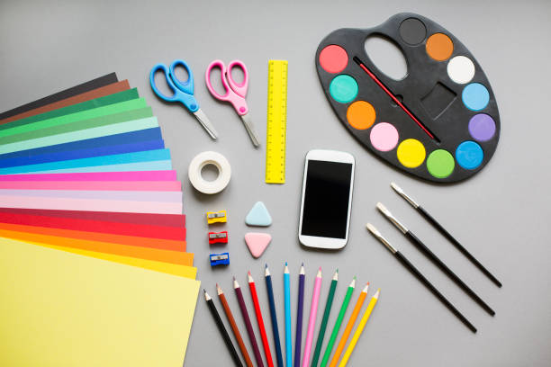 istock Colorful school supplies on grey background 829436698