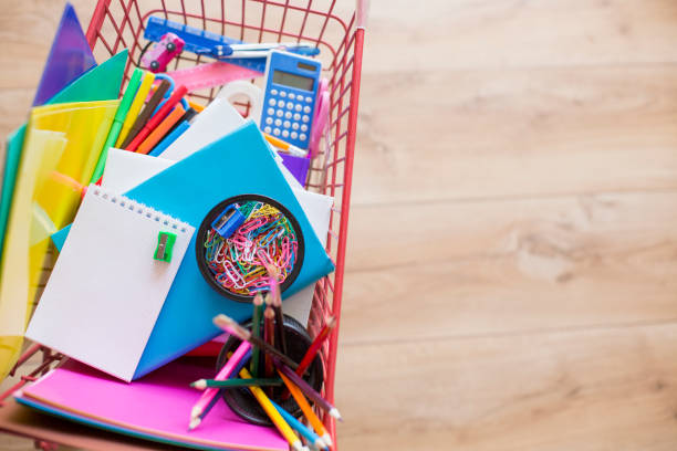 School supplies in shopping cart.