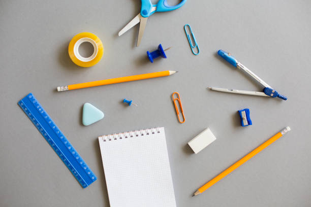 istock Office supplies on grey background 829436856