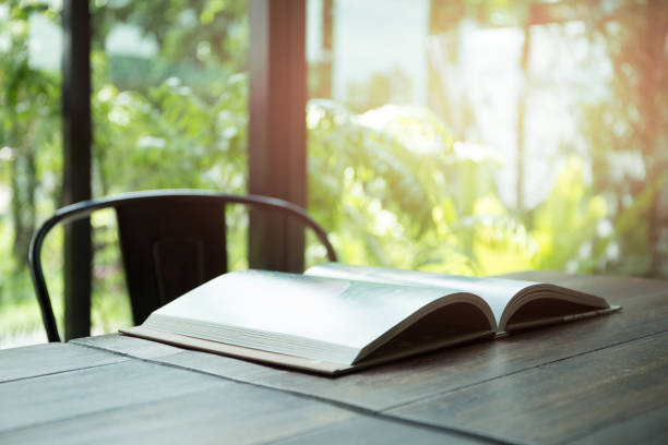 istock Selective focus of the open magazine on wooden table 829446444