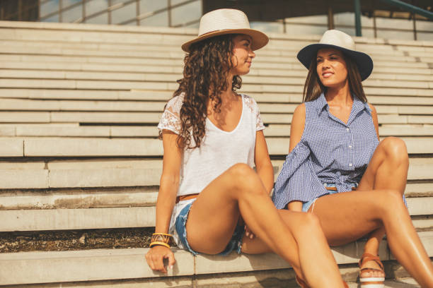 istock Two young women talking outdoors 829451684