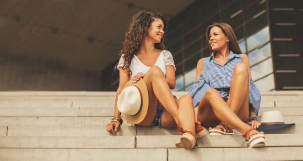 istock Girls sitting on staircase 829451694