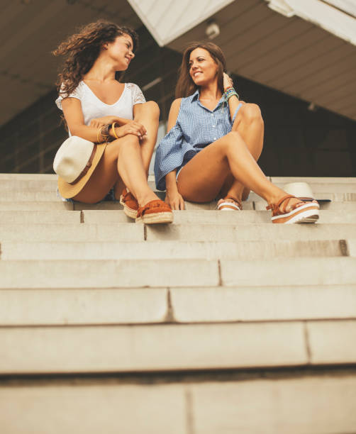 istock Smiling women relaxing outdoors 829451702