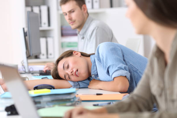 istock Fatigued employee sleeping at office 829453144