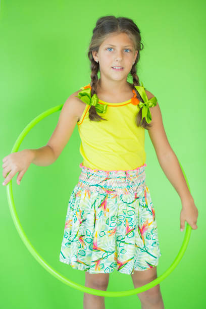istock Girl playing with plastic hoop 829461290