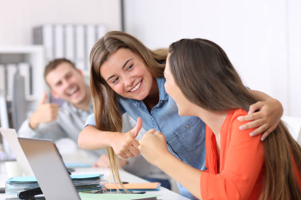 istock Colleagues congratulating to a successful employee 829466908