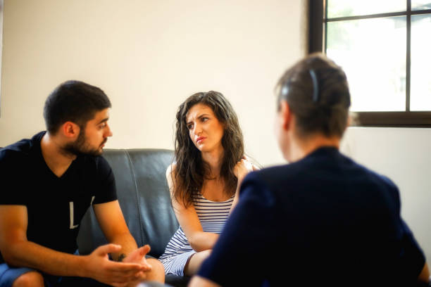 istock Young couple with a problem to consult a psychologist 829467748