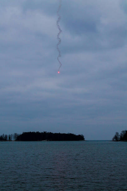 emergency rocket on cloudy day - distress rocket imagens e fotografias de stock