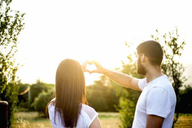 istock Young couple in love on sunset 829480164