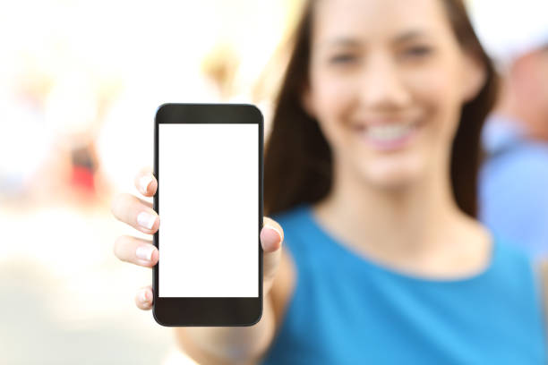 istock Female showing a blank vertical phone screen 829480774