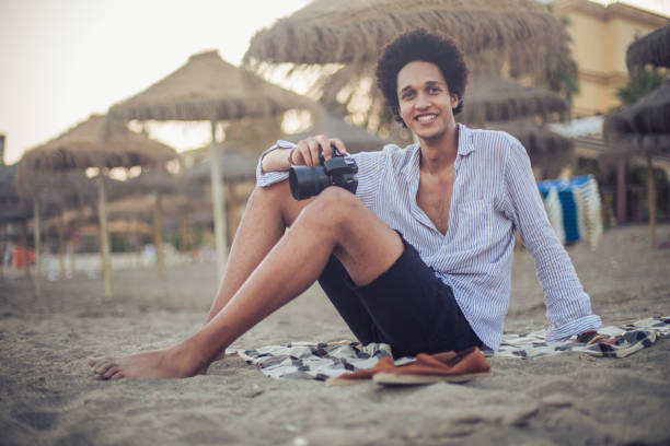 istock Young photographer at the beach 829481588