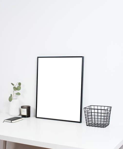 istock white office interior, stylish work table space with poster artw 829489954