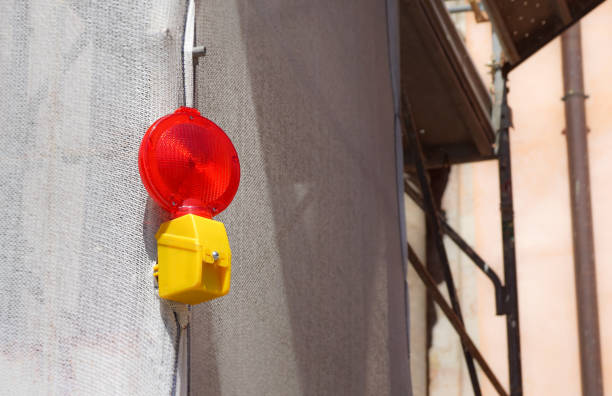 istock Barricade and Warning Light Closeup . Red street light for work 829496124