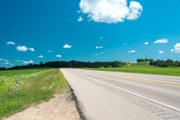 istock Road on a field in Illinois country side 829505176
