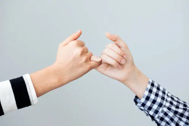 Photo of The gesture of the hands mean the promise