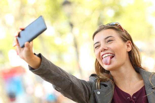 istock Teen taking selfies and grimacing 829509256