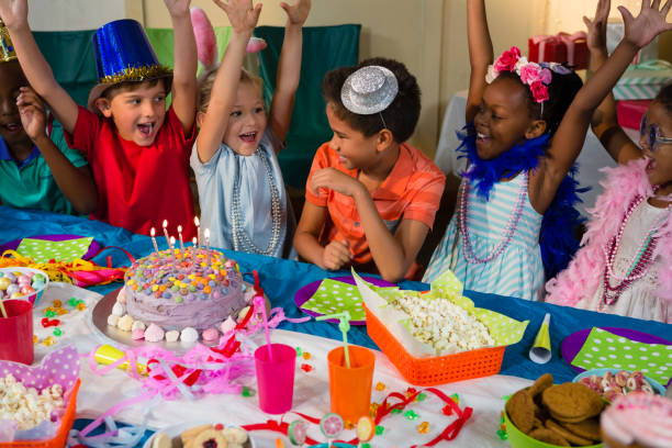 istock Cheerful children with arms raised 829509422