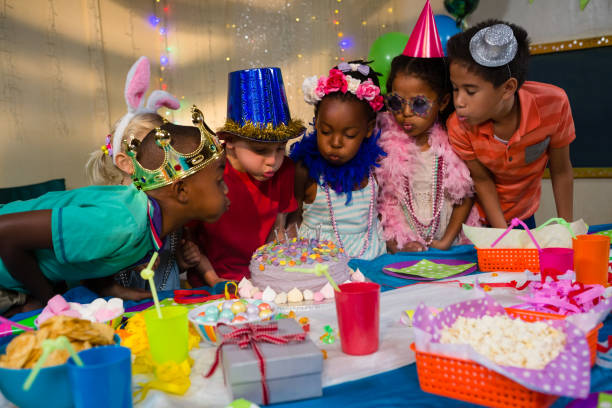 istock Children blowing candles on cake 829510842