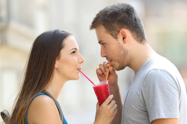 istock Couple sipping a slush together 829520166