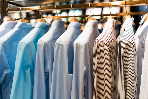 istock Men suits hanging in a clothing store. 829521020