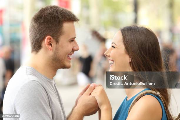 Couple In Love Holding Hands On The Street Stock Photo - Download Image Now - Face To Face, Adult, Boys