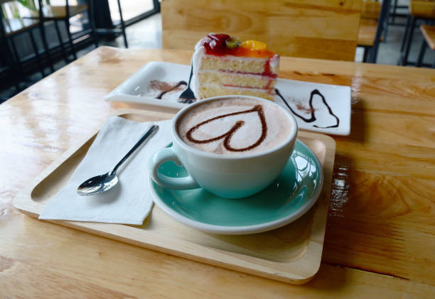 istock a cup of coffee and cake  on  wooden table 829526780