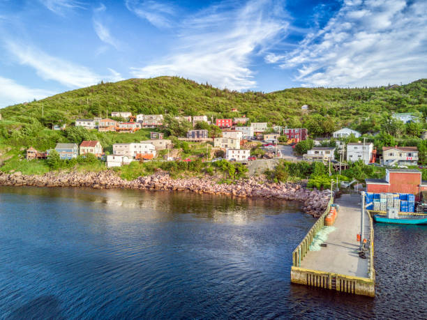 istock Petty Harbour with two piers during summer sunset, Newfoundland, Canada 829540932